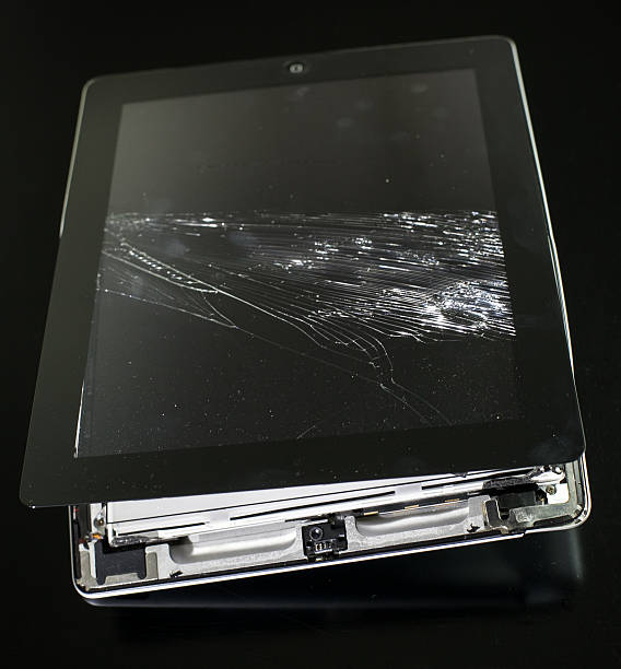 Destroied Apple Ipad Rome, Italy - January 11, 2014: An iPad overrun by a passing car, is smashed and completely useless. broken digital tablet note pad cracked stock pictures, royalty-free photos & images