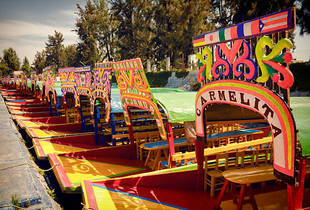 Colorful Boats of Xochimilco parked in a Row stock photo