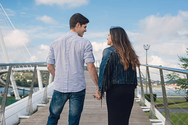 istock Loving couple holding hands 472116544