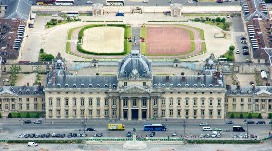 Paris, France - June 6, 2013: Aerial view of Ecole Militaire from the Eifel Tower. Ecole Militaire is in the Parc du Champs de Mars with the Mur pour la Paix (Wall for peace) art installation. The park is a popular spot for picnics or outdoor sports for the Parisians - especially at this warm and sunny spring afternoon.