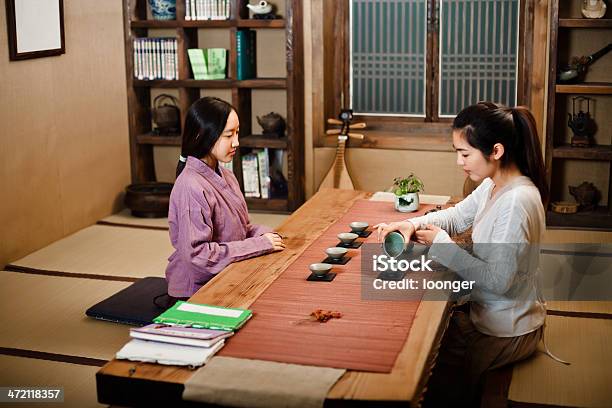 Two East Asian Girl Showing Tea Ceremony Stock Photo - Download Image Now - Clothing, 16-17 Years, 20-29 Years