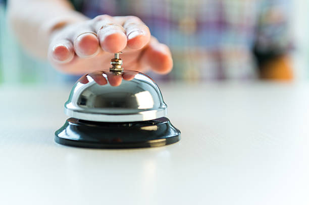 istock Hotel service bell with customers hand 472118695
