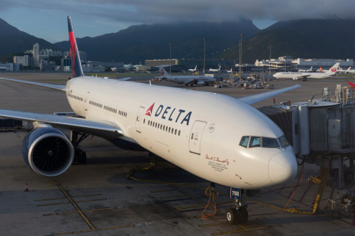 Hong Kong, China - August 29, 2013: Delta Air Lines Boeing 777 parked at the Hong Kong International Airport in Hong Kong, China. It is the world's largest airline in terms of fleet size.