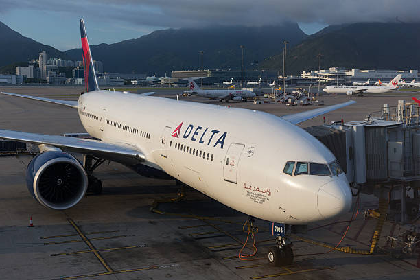 Delta Airlines Boeing 777 Hong Kong, China - August 29, 2013: Delta Air Lines Boeing 777 parked at the Hong Kong International Airport in Hong Kong, China. It is the world's largest airline in terms of fleet size. delta stock pictures, royalty-free photos & images