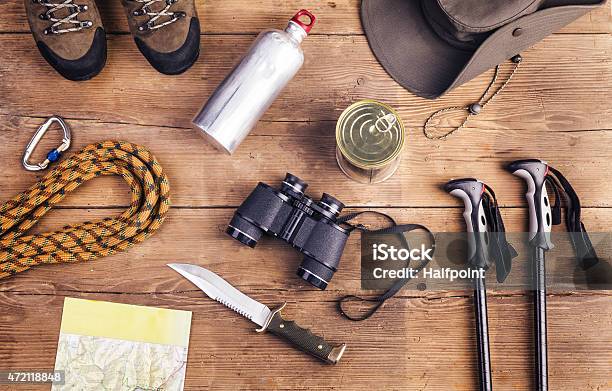 Aerial View Of Hiking Equipment On A Wooden Table Stock Photo - Download Image Now - 2015, Activity, Adventure