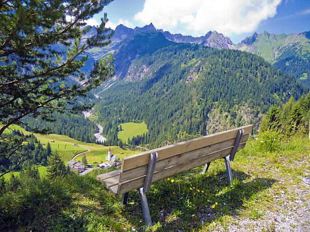 istock bench for hikers in the alps 472118954