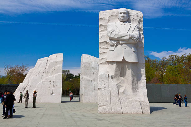 Washington DC, USA - March 28, 2012: Martin Luther King, Jr. Memorial. It is located in West Potomac Park in Washington, D.C., southwest of the National Mall.  Sculptor: Lei Yixin. Material: Granite. Opening date: October 16, 2011. Tourists are walking around and enjoying the monument.