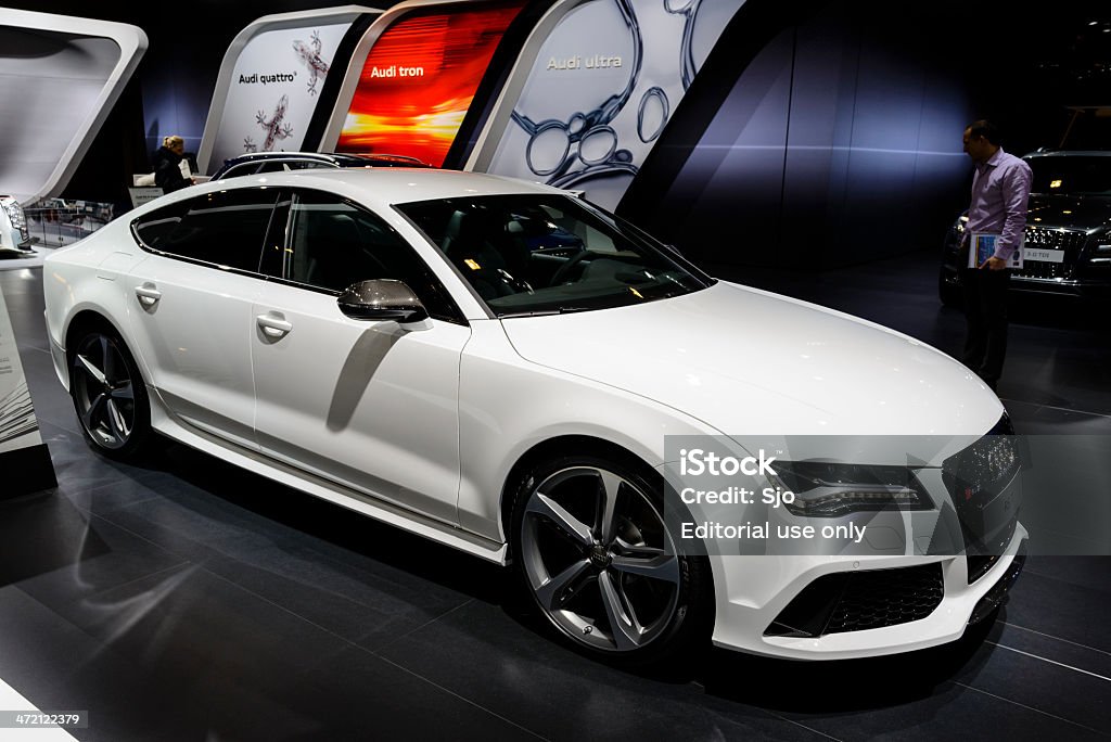 Audi RS7 Sportback Brussels, Belgium - January 14, 2014: White Audi RS7 Sportback four door executive car on display at the Brussels motor show. People in the background are looking at the cars. 2014 Stock Photo