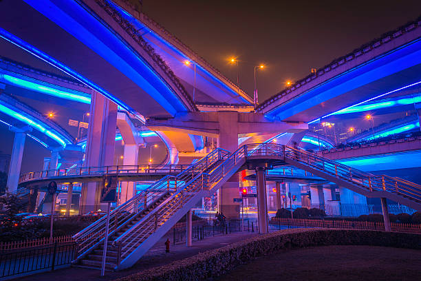 Shanghai, China - 5th October 2012: Electric blue neon lights illuminating the futuristic walkways and mulit-layered highways of the Yan'an Expressway interchange in the Huangpu district of Shanghai, China.