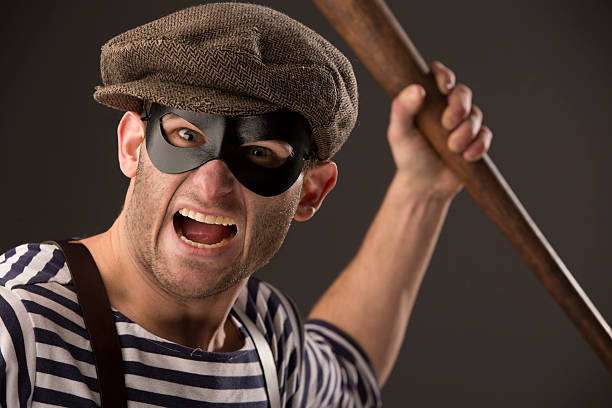 istock Teamster yelling and waving a baseball bat 472123525