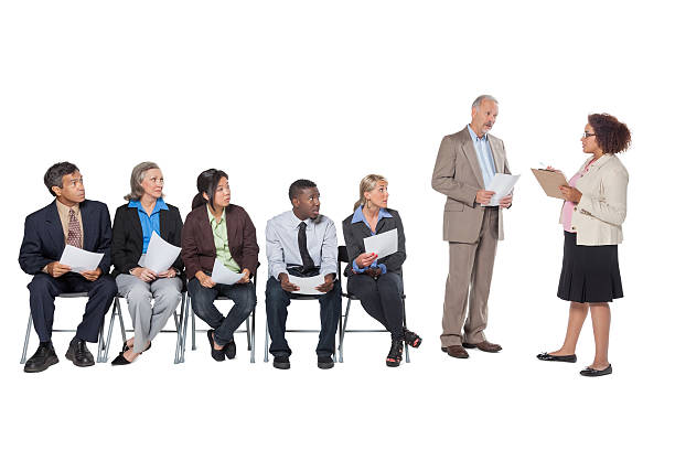 istock Diverse people waiting in line at employment agency; studio shot 472124155