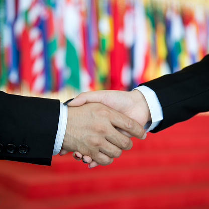 businessman and businesswoman shaking hands.