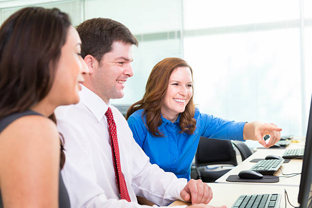 istock Professional Business Team Working on Computer Together During Training Seminar 472125707