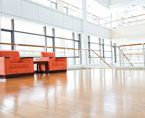 istock Office reception with orange lounges and large windows 472126181