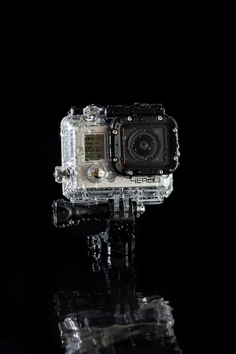Hamburg, Germany - January 17, 2014: A GoPro hero 3 Action-cam in the waterproof case with water drops on black background