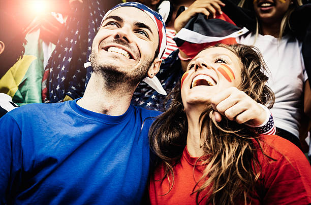 istock Fans of different nations at the stadium together 472127735