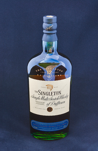 Kiev, Ukraine - June 09, 2012: Bottle of 12 years old Singleton Single Malt Scotch Whisky of Dufftown against blue background in Kiev, Ukraine.