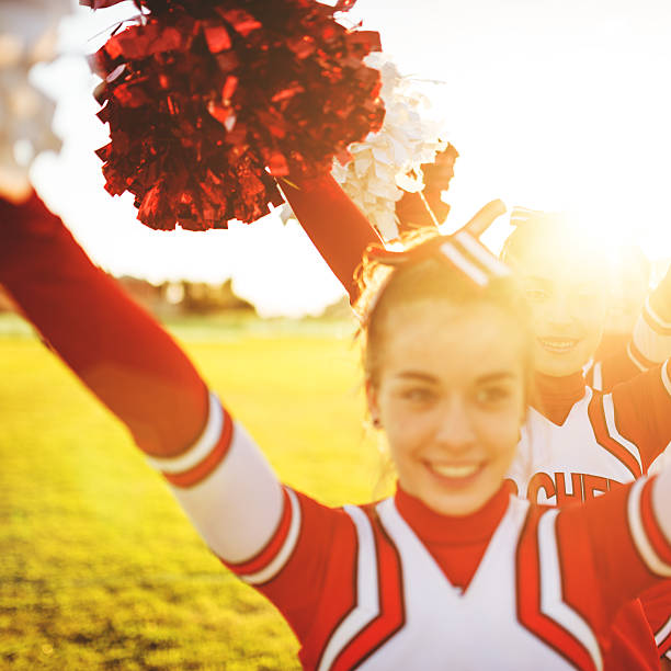 istock Happiness cheerleader posing with pon-pon 472128159