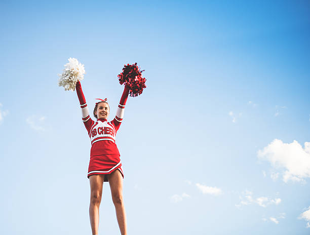 istock Cheerleader on top of the success 472128183