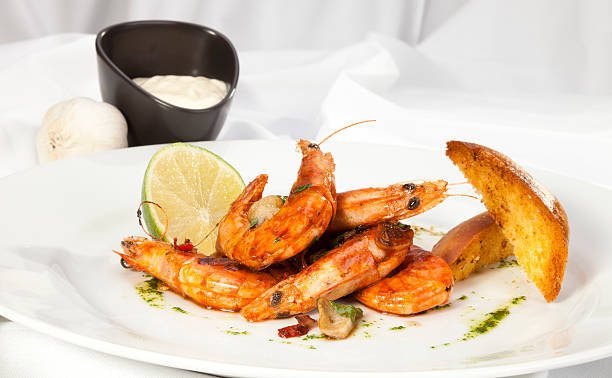 istock Shrimps prepared with garlic, chilli, white wine 472128225