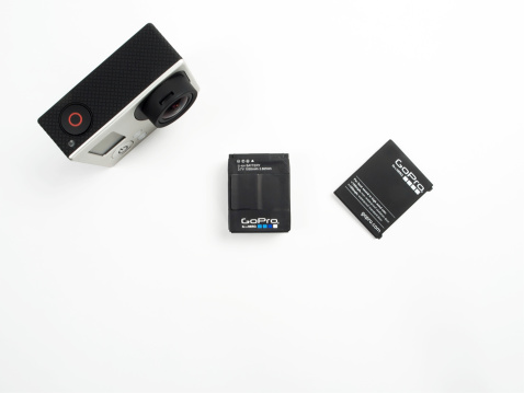 Istanbul, Turkey - January 17, 2014: Close-up studio shot of a GoPro HERO3 black edition camera with Rechargeable Battery and cover.