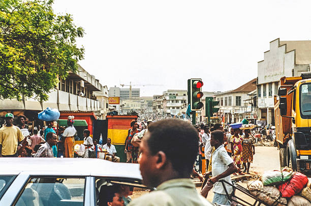 Accra, Ghana - January 6, 1999: Crowded market streets in the centre of capital city. Shot on film.