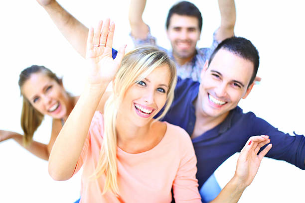 Portrait of friendly business people standing together on white background