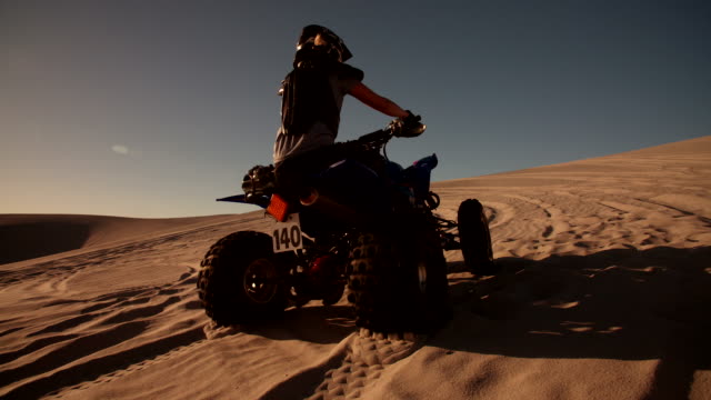 Quad bike with excellent tyre tread going uphill
