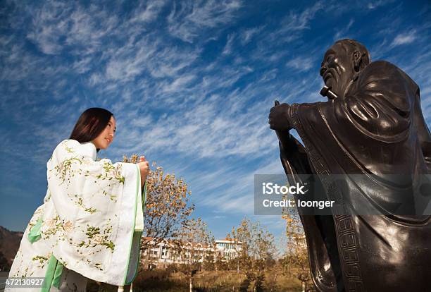 Girl Bowed To Confucius Stock Photo - Download Image Now - Confucius, 16-17 Years, Adult