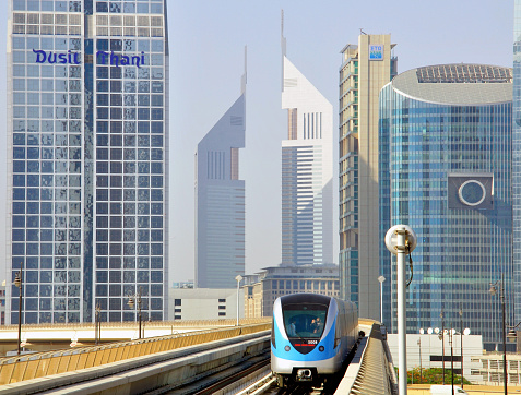 Dubai, UAE - June 12, 2012: High speed metro train in Dubai city on June 12, 2012. Dubai is a city in the United Arab Emirates, located within the emirate of the same name