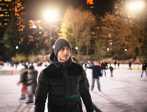 istock Serious man on the Central Park ice rink - winter 472131031