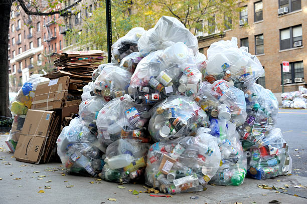 Big pile of waste garbage New York, USA - November 15, 2012: Streets filled with garbage bags on the sidewalk due to the super storm Sandy. November 15, 2012 ,New York,USA. superstorm stock pictures, royalty-free photos & images