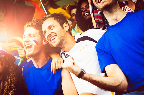 istock Fans of different nations at the stadium together 472131285