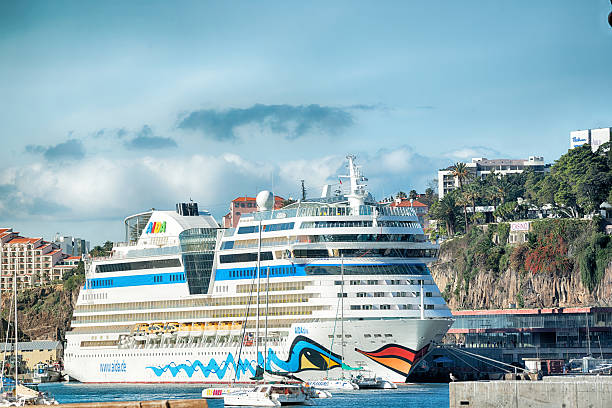 Funchal, Portugal - January 14, 2014: Passenger cruise ship AIDAblu at the harbor of Funchal, Madeira . AIDAblu is one of the biggest passengers cruise ship of the operator AIDA Cruises.It was christened at February 9, 2010 in Hamburg. AIDAblu has 1096 cabins for 2050 passengers.