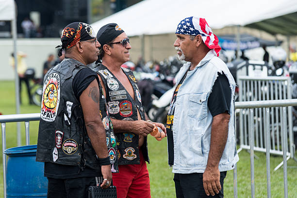Rio das Flores (Rio de Janeiro), Brazil - April 13, 2012: Men at the motorcycle meeting in Rio das Flores. The Motorcycle Rio das Flores is annual meeting and event which brings bikers from various regions of Brazil to the small town of Rio das Flores, in the state of Rio de Janeiro.