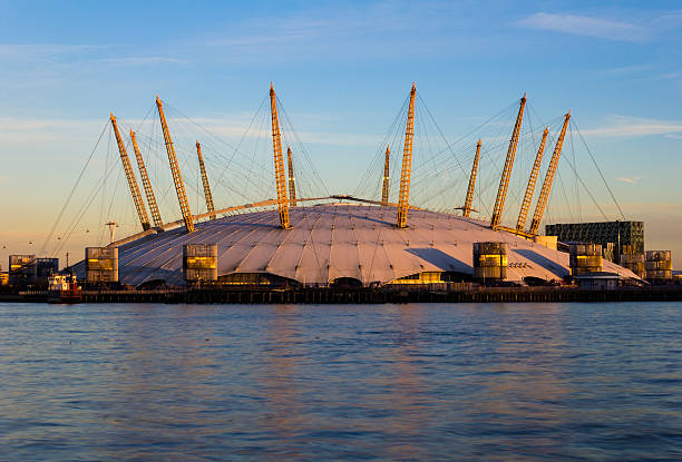 London, UK - January 21, 2014: The O2 Arena in London at sunset. The venue contains shops, bars, cinemas, clubs and often holds entertainment concerts.