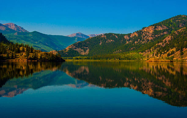 istock Lake San Cristobal reflection Summer Sunrise 472133324