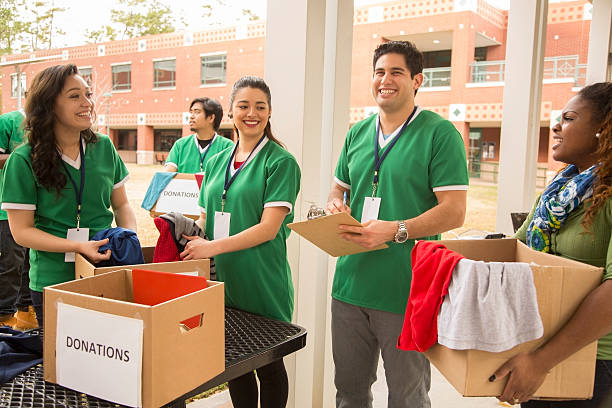 istock Volunteers: College students collect clothing donations for community. 472133543