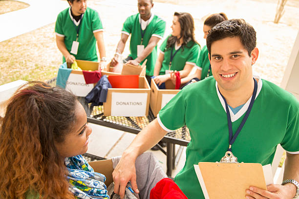 istock Volunteers: College students collect clothing donations for needy. 472133573