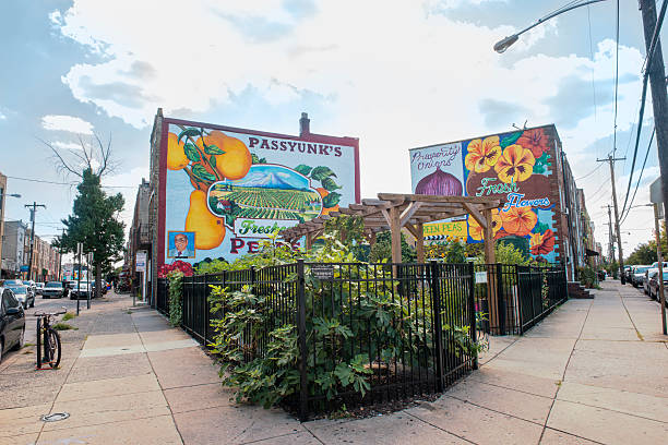 Philadelphia - August 15, 2013: A corner lot in the Passyunk neighborhood is decorated with murals and an urban garden.
