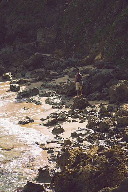 istock Man hiking at the beach 472135335