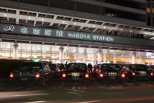 Nagoya, Japan - March 21, 2012 : Taxi drivers waiting passengers in front of Nagoya Station. Nagoya Station is located in Meieki, Nakamura, Nagoya, Aichi Prefecture, Japan. This station is operated by Central Japan Railway Company. 