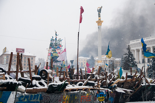 Kiev, Ukraine - January 22, 2014: Anti-Government protest on the street Hrushevskoho after news about police shot and killed 2 protesters with live ammunition. The 2014 Hrushevskoho Street riots are an ongoing series of demonstrations and rioting in central Kiev that began on 19 January 2014 on Hrushevskoho Street, outside of Dynamo Stadium and adjacent to the ongoing Euromaidan protests.