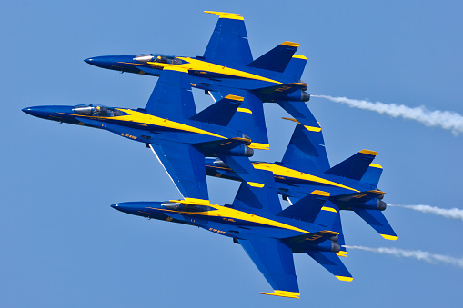 Patuxent River, USA - September 4, 2011: US Navy Blue Angels performing demo routine flying F-18 Hornets with special livery celebrating colors of US Navy on September 4, 2011 in Patuxent River, Maryland. Blue Angels is the oldest and is considered the best Demonstration Squadron in the world.