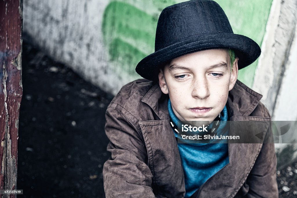 teenage boy with hat depression depressed teenage boy, wearing hat, looking down 14-15 Years Stock Photo