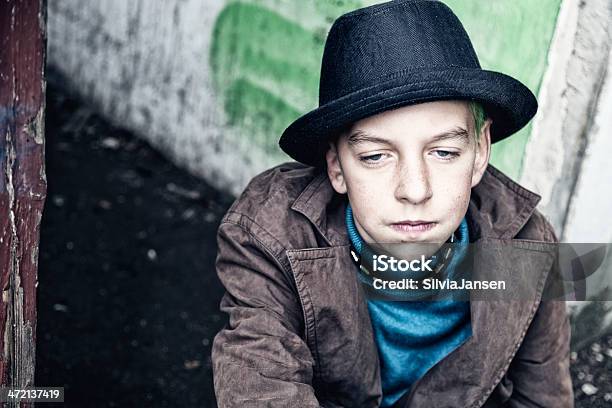 Teenage Boy With Hat Depression Stock Photo - Download Image Now - 14-15 Years, Adolescence, Beige