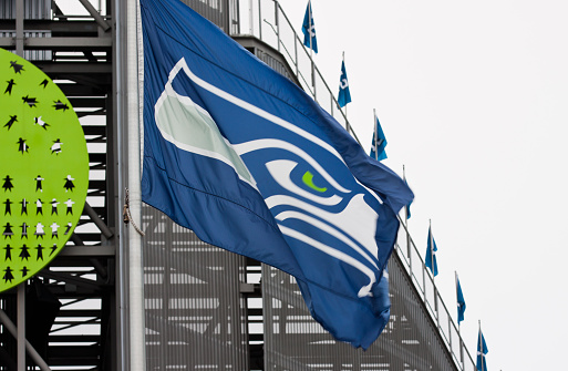 Seattle, United States - January 23, 2014:This image shows the exterior of Centurylink Stadium in Seattle, Washington where a Seattle Seahawks flag is flying showing  support for the Hawks! The Seahawks football team are playing in the Superbowl and fans in Seattle and the Northwest are very excited.