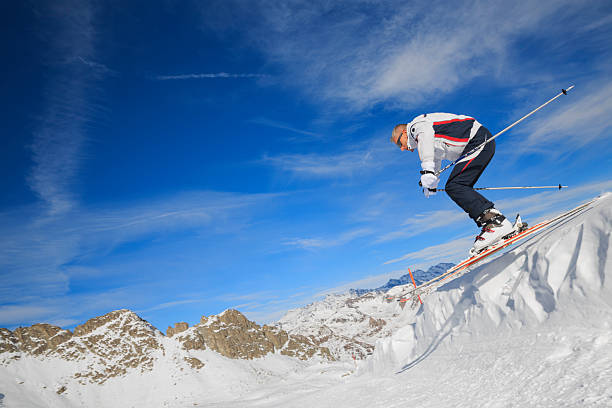 istock Alpine skier in a jump 472138147