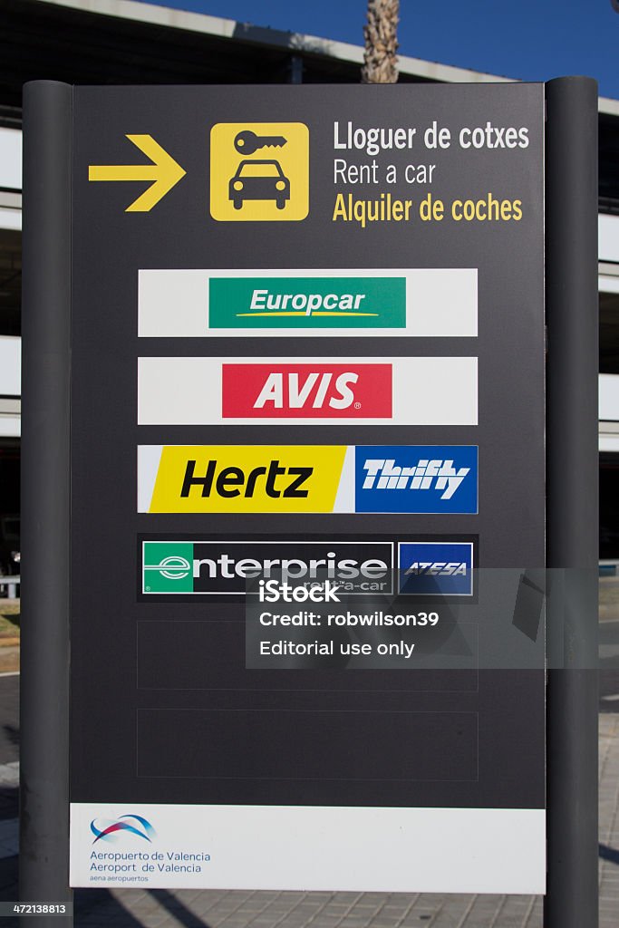 Rental Car Sign Valencia, Spain - January 21, 2014: A rental car sign at the Valencia airport.  The rental car industry is a 31 billion dollar industry worldwide with Hertz having 28% of the market share.  The Hertz Corporation Stock Photo