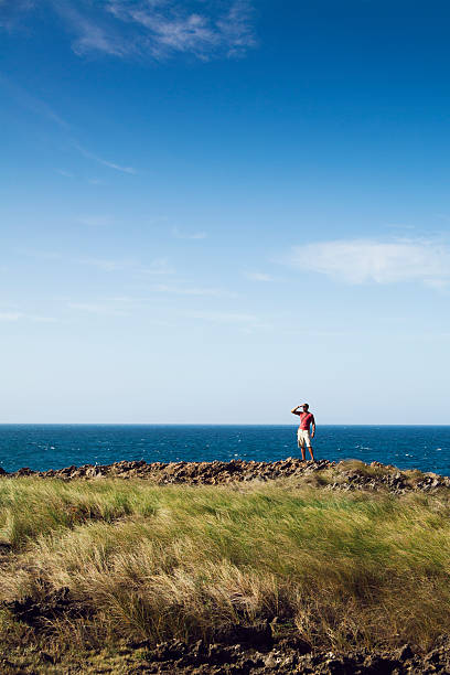Hispanic man hiking at the beach in Puerto Rico